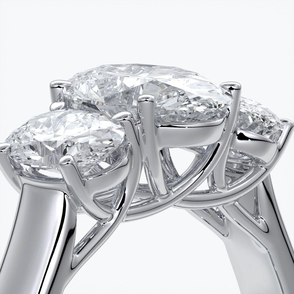 Lucida Engagement ring oval trilogy 4 claw cathedral 18ct white gold