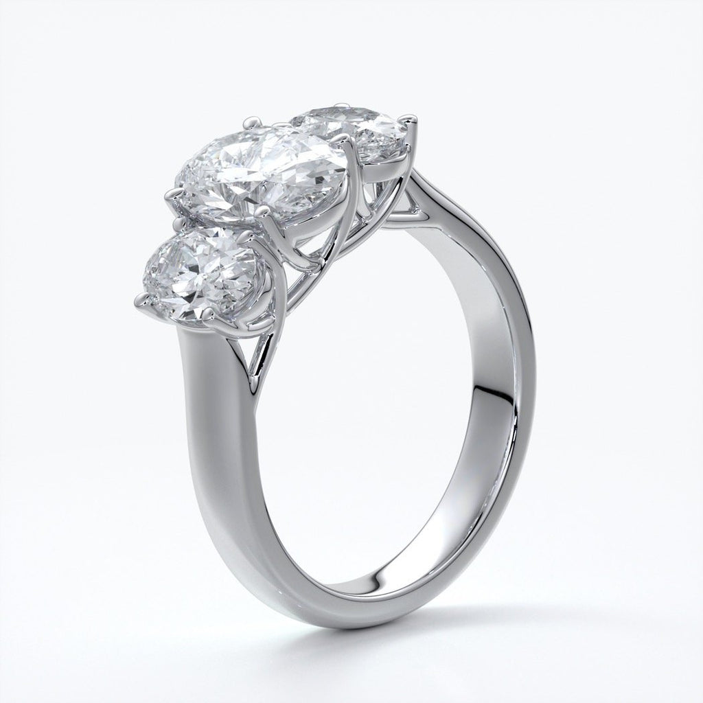 Lucida Engagement ring oval trilogy 4 claw cathedral 18ct white gold
