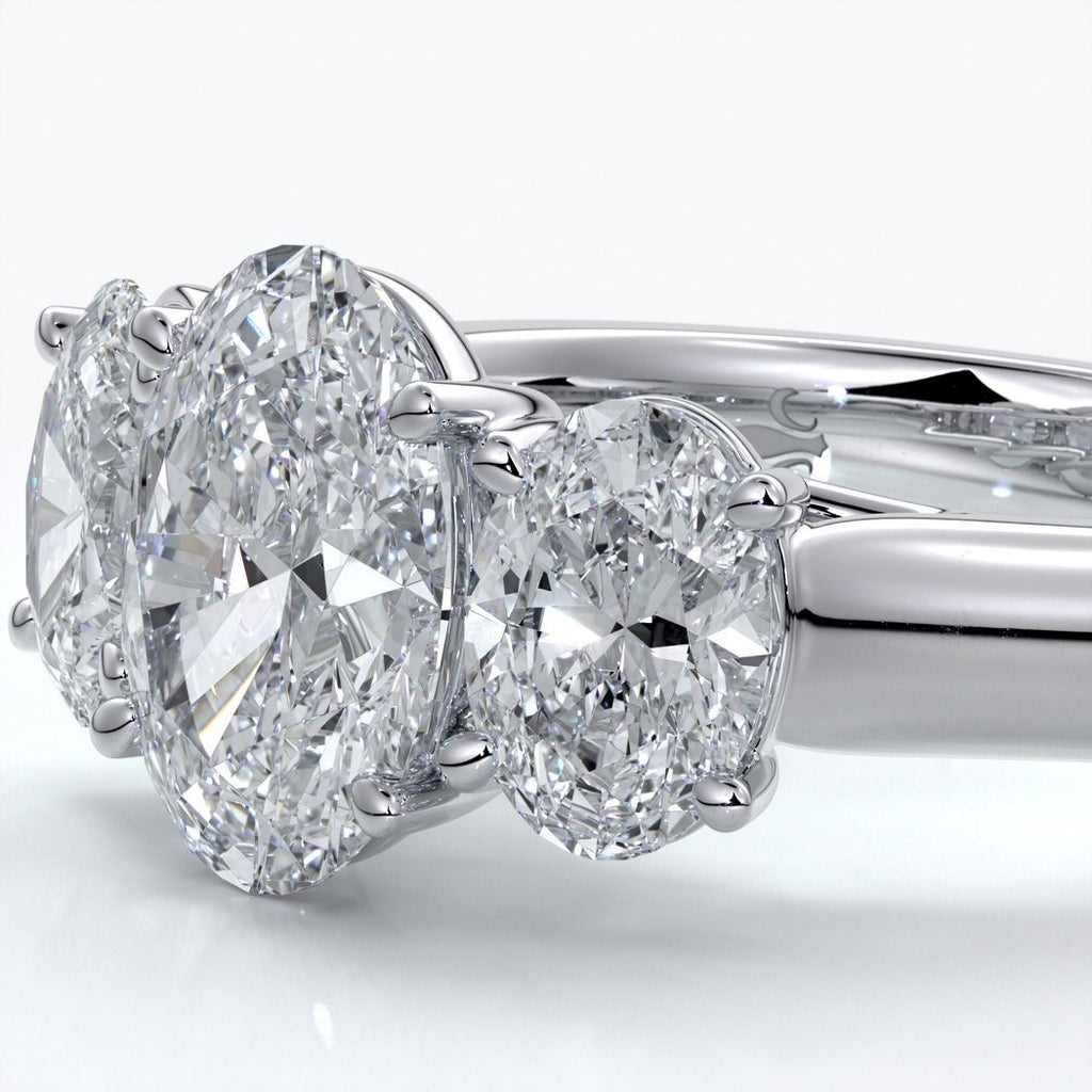 Lucida Engagement ring oval trilogy 4 claw cathedral 18ct white gold